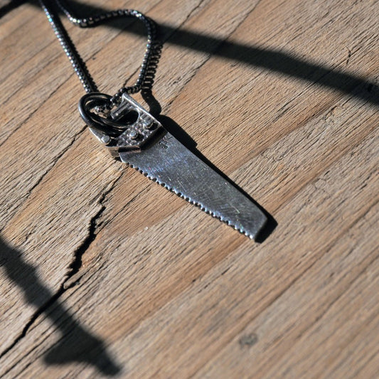 Ornate Silver Handsaw Necklace